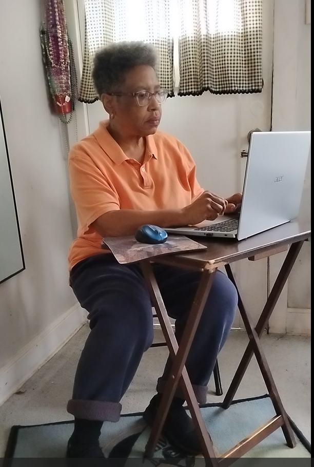 Rawslyn Ruffin working at her laptop